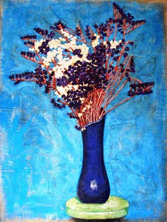Jarrón azul con flores secas
